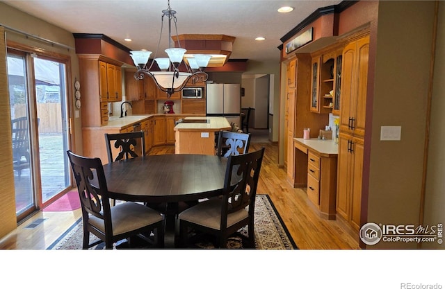 2152 45th Ave, Greeley, CO 80634 - dining space with light wood-style floors, a chandelier, and recessed lighting