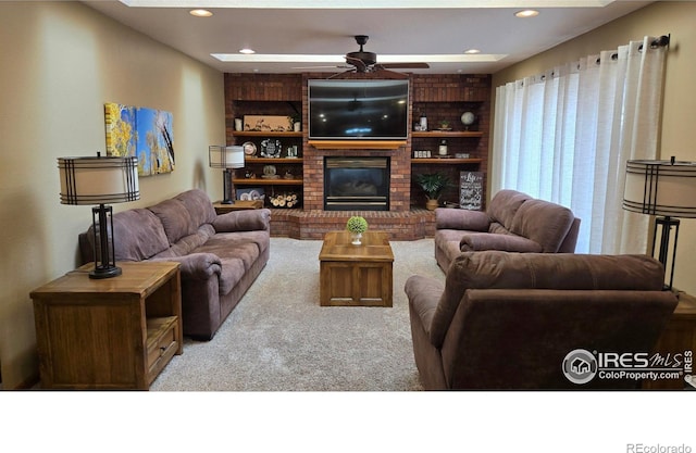 2152 45th Ave, Greeley, CO 80634 - carpeted living room featuring ceiling fan, a fireplace, recessed lighting, and built in shelves