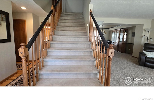 2152 45th Ave, Greeley, CO 80634 - stairway with baseboards, carpet floors, and recessed lighting
