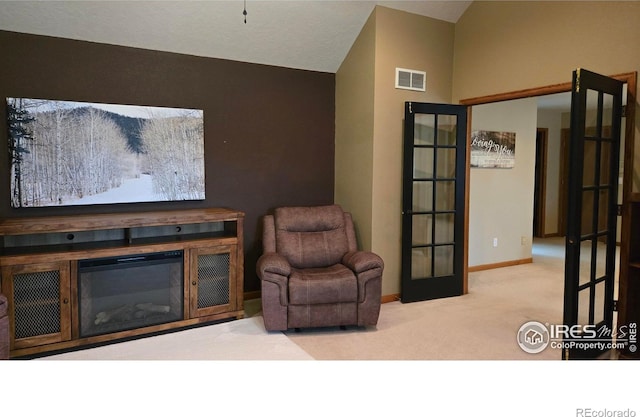 2152 45th Ave, Greeley, CO 80634 - living area featuring carpet, vaulted ceiling, and baseboards