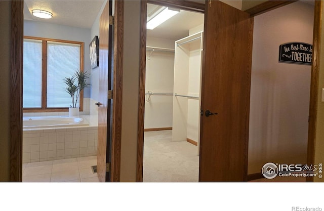 2152 45th Ave, Greeley, CO 80634 - hallway with baseboards and tile patterned flooring