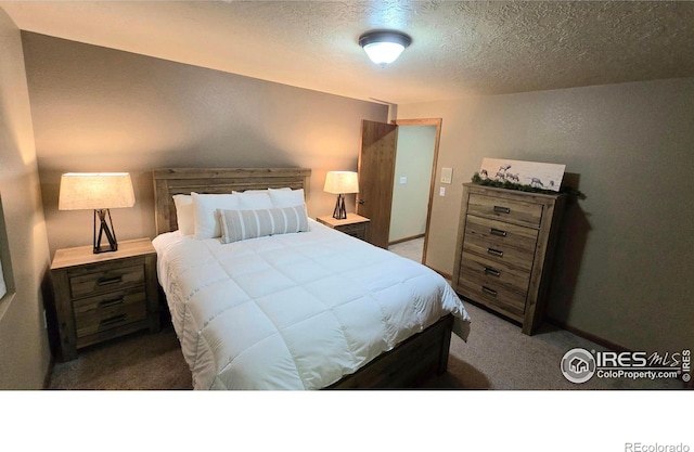 2152 45th Ave, Greeley, CO 80634 - carpeted bedroom with a textured ceiling