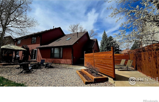 2152 45th Ave, Greeley, CO 80634 - back of house with a gazebo, a patio area, a fire pit, and a shingled roof