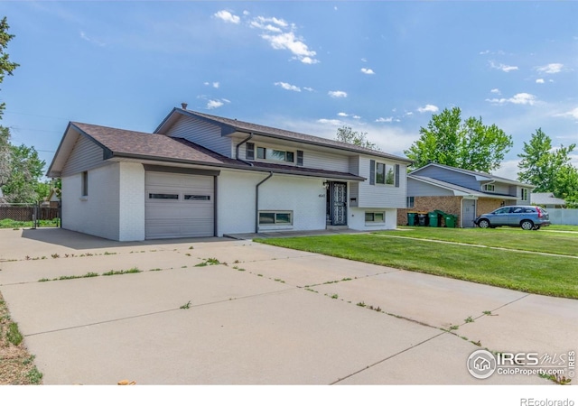 4642 Everett Ct, Wheat Ridge, CO 80033 - view of front of home with concrete driveway, brick siding, and a garage