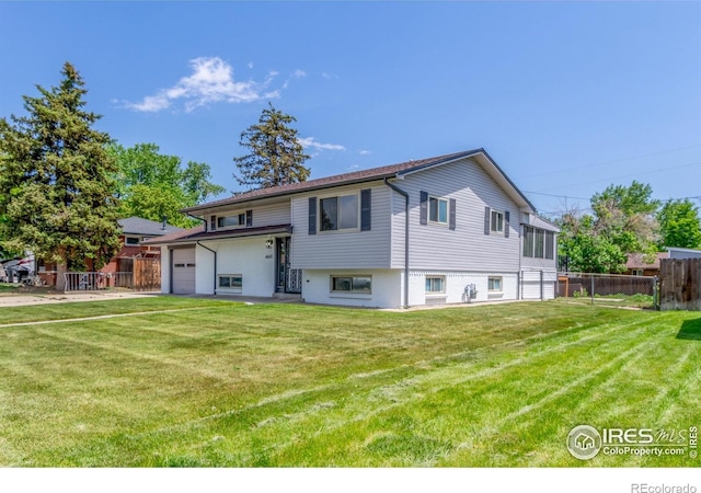 4642 Everett Ct, Wheat Ridge, CO 80033 - rear view of house with a garage