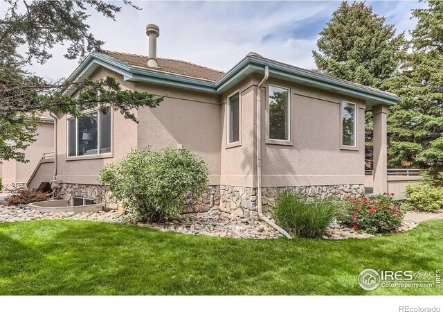4326 Clay Commons Ct, Boulder, CO 80303 - view of property exterior with stucco siding and stone siding
