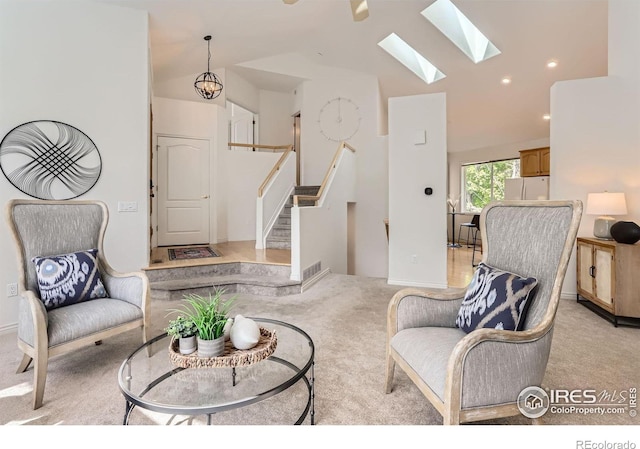 4326 Clay Commons Ct, Boulder, CO 80303 - living room featuring light colored carpet, vaulted ceiling, a skylight, stairs, and recessed lighting