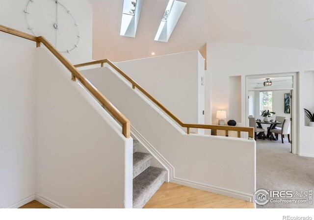 4326 Clay Commons Ct, Boulder, CO 80303 - stairs with a skylight, lofted ceiling, and baseboards