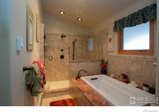 1314 State Highway 66, Longmont, CO 80504 - full bathroom featuring a shower stall, a jetted tub, a baseboard radiator, lofted ceiling, and recessed lighting
