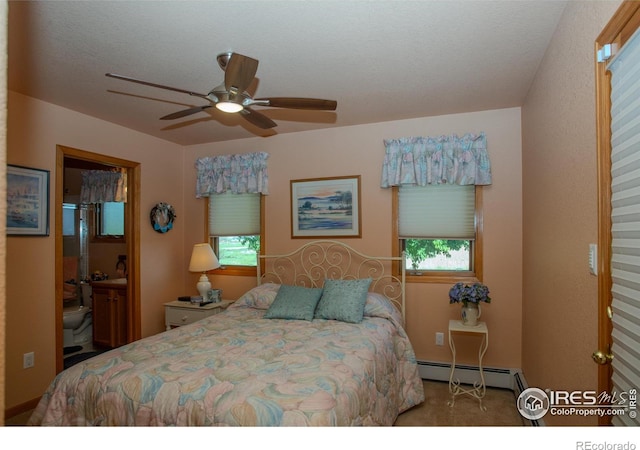 1314 State Highway 66, Longmont, CO 80504 - bedroom featuring a baseboard heating unit, ceiling fan, and connected bathroom