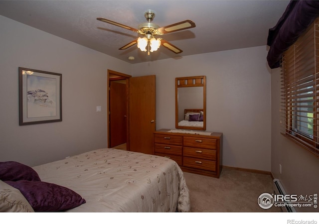 1314 State Highway 66, Longmont, CO 80504 - bedroom with light colored carpet, ceiling fan, and baseboards