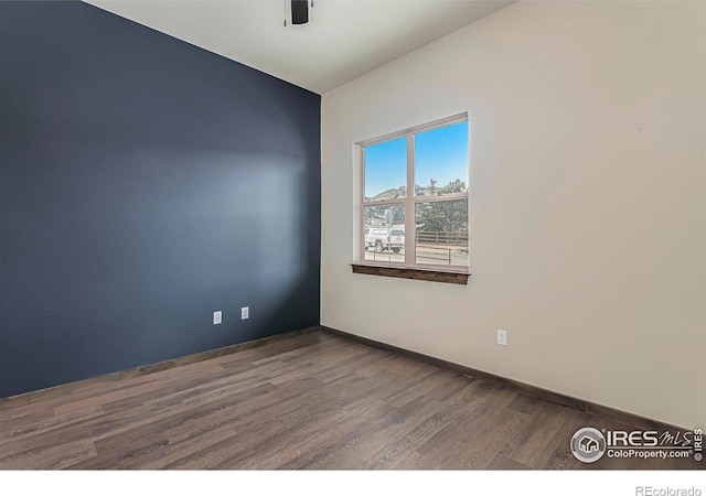 1768 Wildfire Rd Unit 101, Estes Park, CO 80517 - empty room featuring wood finished floors, ceiling fan, and baseboards