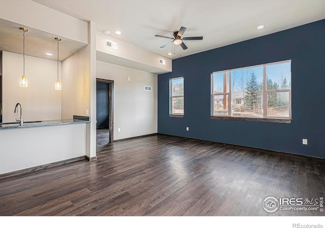1768 Wildfire Rd Unit 101, Estes Park, CO 80517 - unfurnished living room featuring a sink, a ceiling fan, dark wood finished floors, recessed lighting, and baseboards
