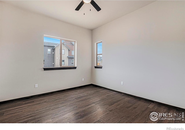1768 Wildfire Rd Unit 101, Estes Park, CO 80517 - unfurnished room with dark wood-style flooring, ceiling fan, and baseboards