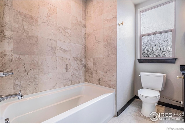 1768 Wildfire Rd Unit 101, Estes Park, CO 80517 - full bath with toilet, a bath, and baseboards