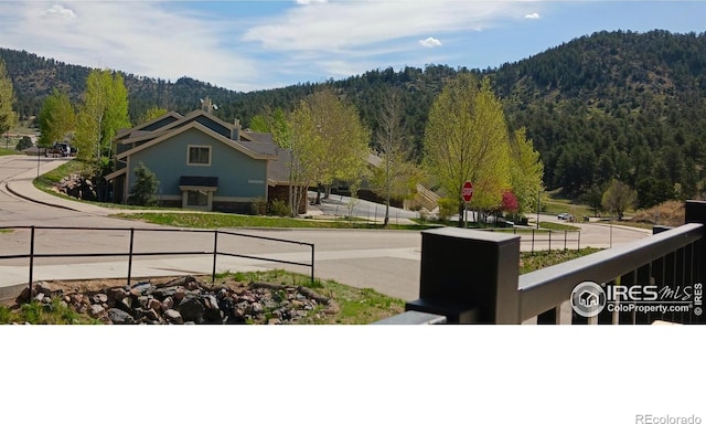1768 Wildfire Rd Unit 101, Estes Park, CO 80517 - mountain view featuring a heavily wooded area