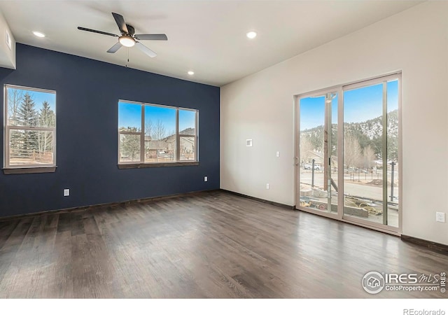1768 Wildfire Rd Unit 101, Estes Park, CO 80517 - empty room featuring wood finished floors, healthy amount of natural light, a ceiling fan, and recessed lighting