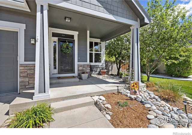 2620 Brush Creek Dr, Fort Collins, CO 80528 - view of exterior entry with stone siding and covered porch