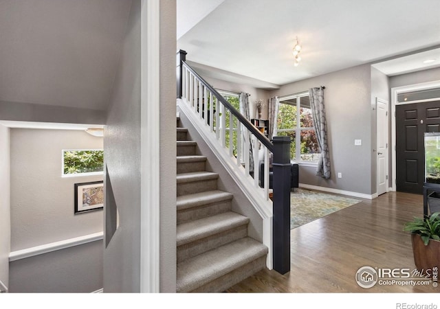 2620 Brush Creek Dr, Fort Collins, CO 80528 - stairway with wood finished floors and baseboards