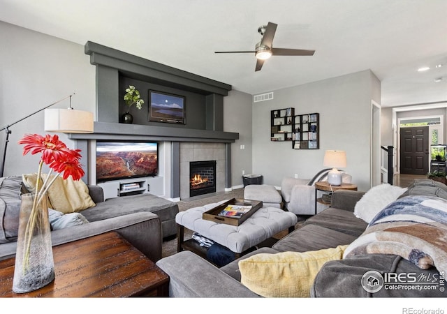 2620 Brush Creek Dr, Fort Collins, CO 80528 - living room featuring ceiling fan and a tiled fireplace