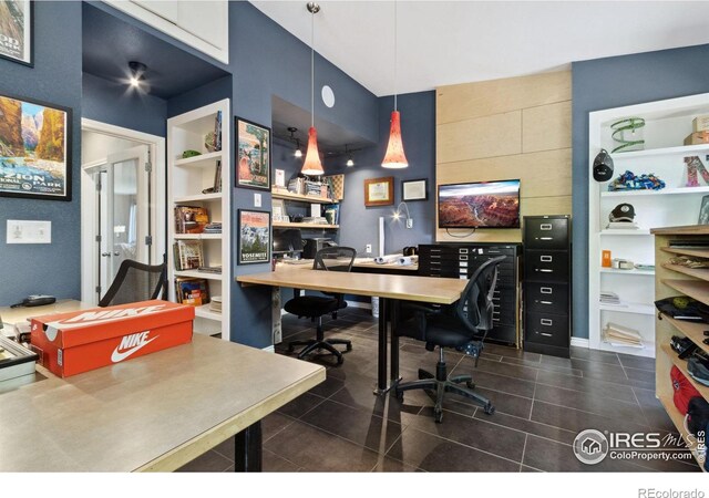 2620 Brush Creek Dr, Fort Collins, CO 80528 - home office featuring built in shelves and dark tile patterned flooring