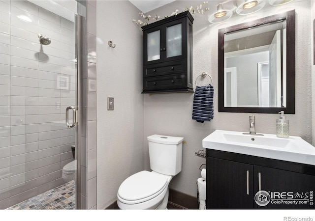 2620 Brush Creek Dr, Fort Collins, CO 80528 - bathroom featuring toilet, vanity, and a shower stall