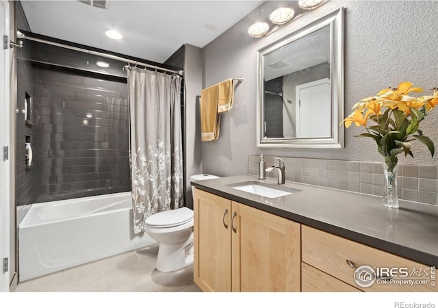 2620 Brush Creek Dr, Fort Collins, CO 80528 - full bath featuring toilet, vanity, shower / bath combo, tile patterned flooring, and a textured wall