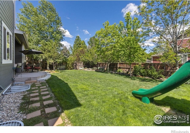 2620 Brush Creek Dr, Fort Collins, CO 80528 - view of yard featuring a patio area and a playground