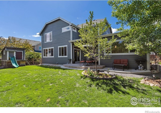 2620 Brush Creek Dr, Fort Collins, CO 80528 - rear view of property with a patio, a lawn, and a playground