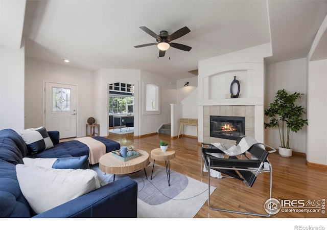 5026 Brookfield Dr Unit A, Fort Collins, CO 80528 - living room featuring wood finished floors, a ceiling fan, a tile fireplace, baseboards, and recessed lighting