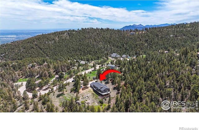 1100 Deer Trail Rd, Boulder, CO 80302 - aerial view of a forest and a mountain backdrop