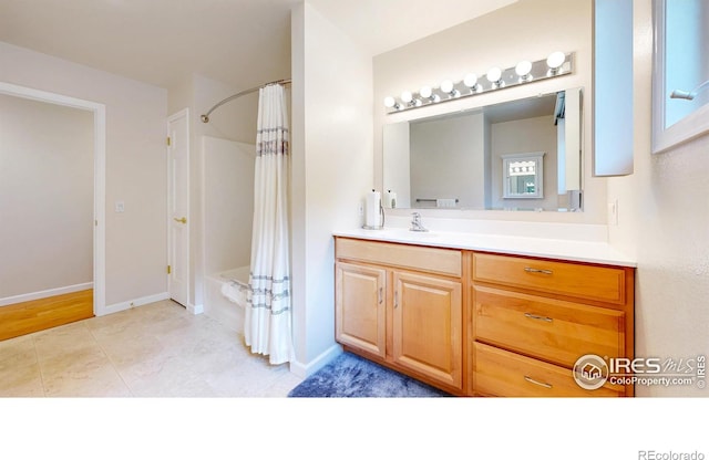 1100 Deer Trail Rd, Boulder, CO 80302 - bathroom with vanity, shower / bath combo, baseboards, and tile patterned floors