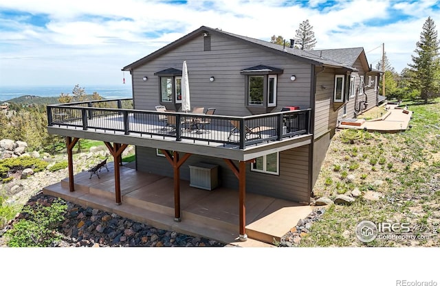 1100 Deer Trail Rd, Boulder, CO 80302 - rear view of house featuring a wooden deck and a patio area