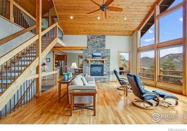 303 Curry Dr, Estes Park, CO 80517 - living room featuring high vaulted ceiling, ceiling fan, a mountain view, wood finished floors, and wooden ceiling