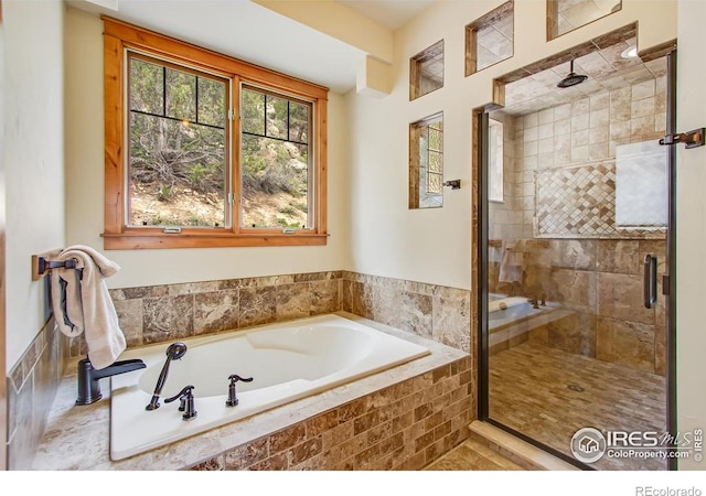303 Curry Dr, Estes Park, CO 80517 - bathroom featuring a bath and a shower stall