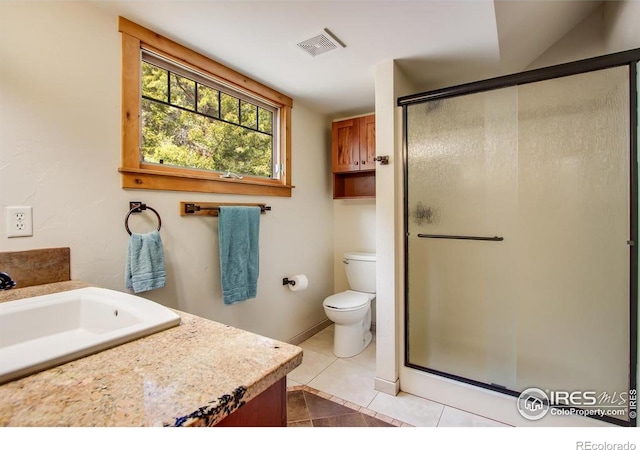 303 Curry Dr, Estes Park, CO 80517 - full bath featuring vanity, a shower stall, toilet, and tile patterned flooring