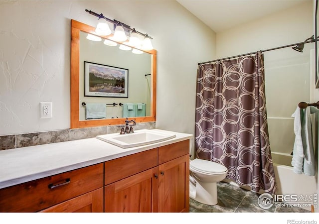 303 Curry Dr, Estes Park, CO 80517 - full bathroom featuring vanity, shower / bathtub combination with curtain, and toilet