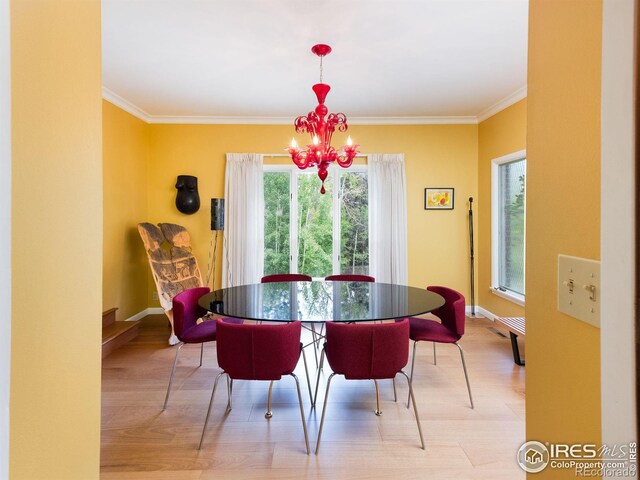 1035 Rosehill Dr, Boulder, CO 80302 - dining room with a chandelier, light wood-style floors, ornamental molding, and baseboards