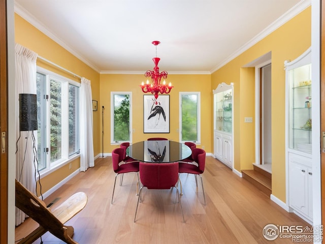 1035 Rosehill Dr, Boulder, CO 80302 - dining area with light wood finished floors, ornamental molding, a chandelier, and baseboards
