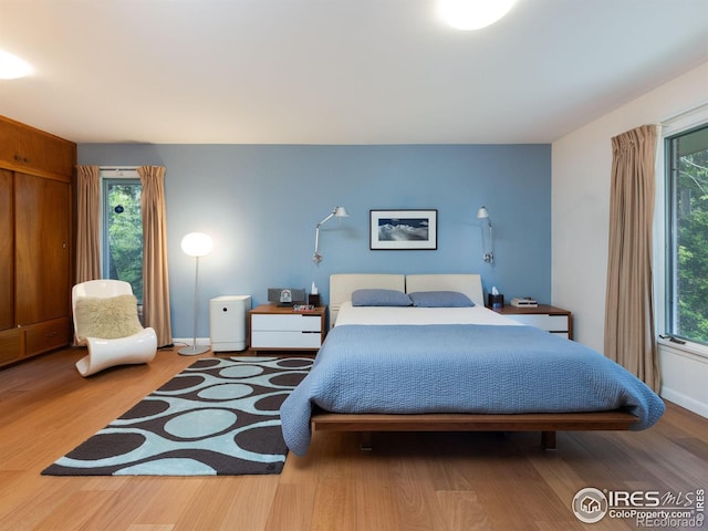 1035 Rosehill Dr, Boulder, CO 80302 - bedroom featuring wood finished floors and baseboards