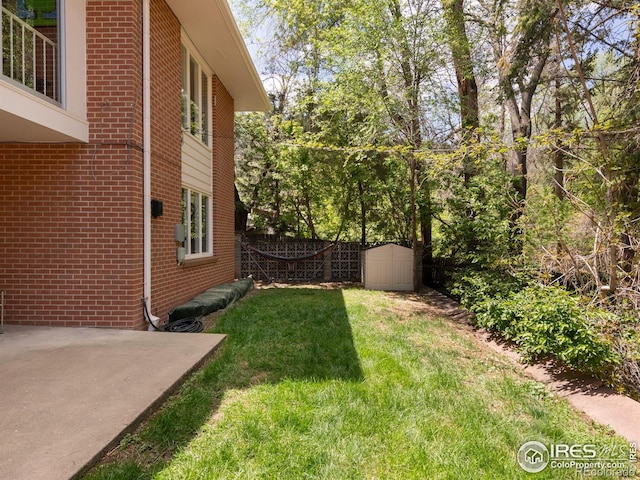 1035 Rosehill Dr, Boulder, CO 80302 - view of yard with a patio and a storage unit