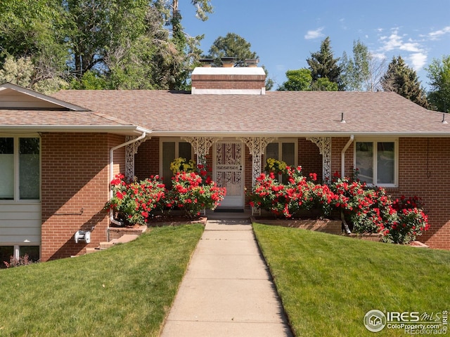 1035 Rosehill Dr, Boulder, CO 80302 - ranch-style house featuring a front yard, brick siding, a shingled roof, and a chimney