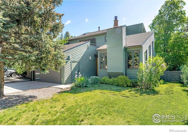 3470 16th Cir, Boulder, CO 80304 - view of front facade featuring a front lawn, a chimney, a garage, roof with shingles, and concrete driveway