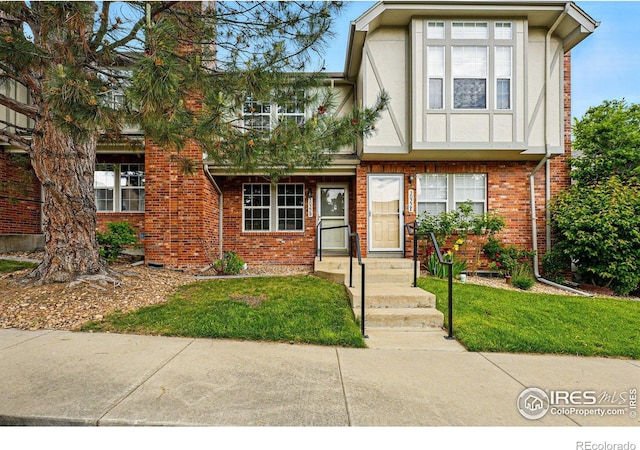 3022 W 107th Pl Unit D, Westminster, CO 80031 - view of front facade with brick siding and a front yard