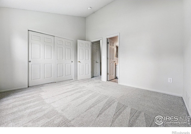 3022 W 107th Pl Unit D, Westminster, CO 80031 - unfurnished bedroom featuring carpet flooring, baseboards, a closet, ensuite bathroom, and a high ceiling