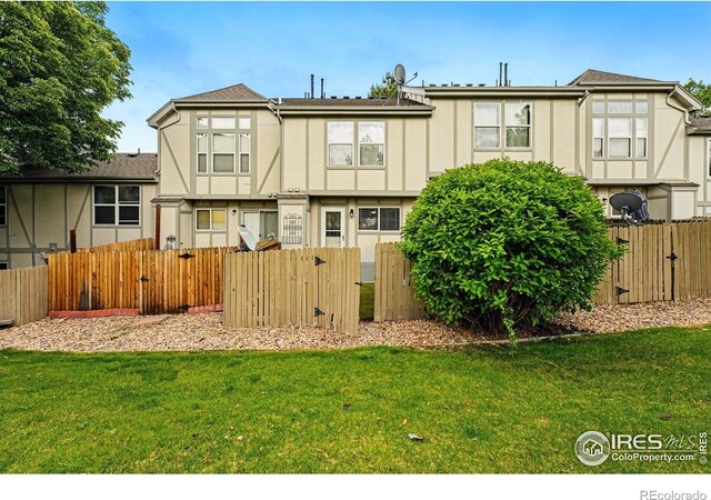 3022 W 107th Pl Unit D, Westminster, CO 80031 - rear view of house featuring a gate and stucco siding