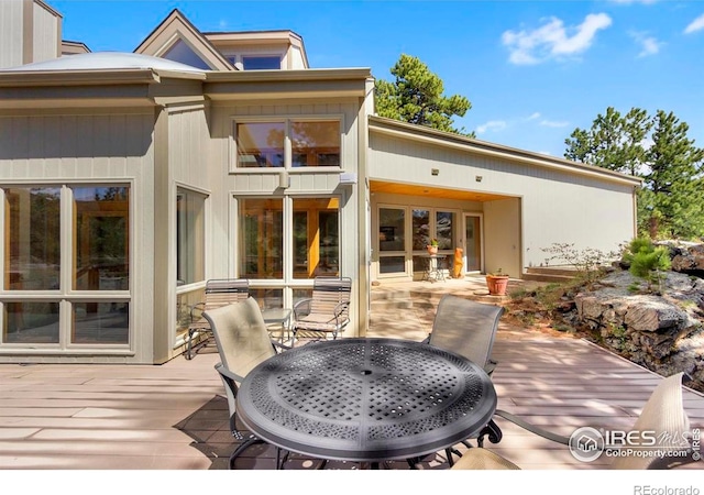 125 Saddleback Ln, Estes Park, CO 80517 - wooden terrace featuring outdoor dining area