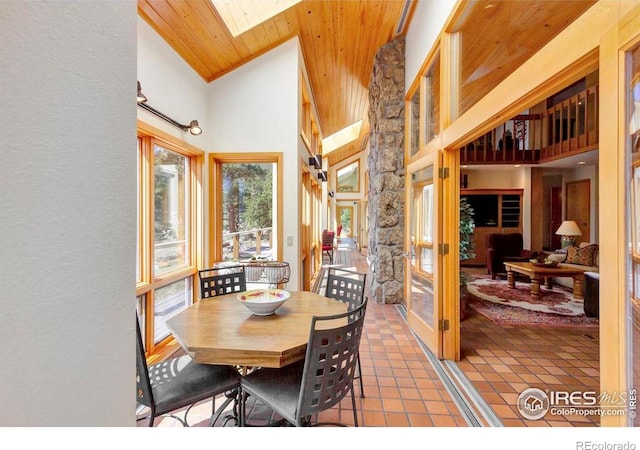 125 Saddleback Ln, Estes Park, CO 80517 - tiled dining room with a towering ceiling, a skylight, and wooden ceiling