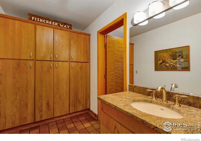 125 Saddleback Ln, Estes Park, CO 80517 - bathroom featuring vanity, a closet, and tile patterned flooring
