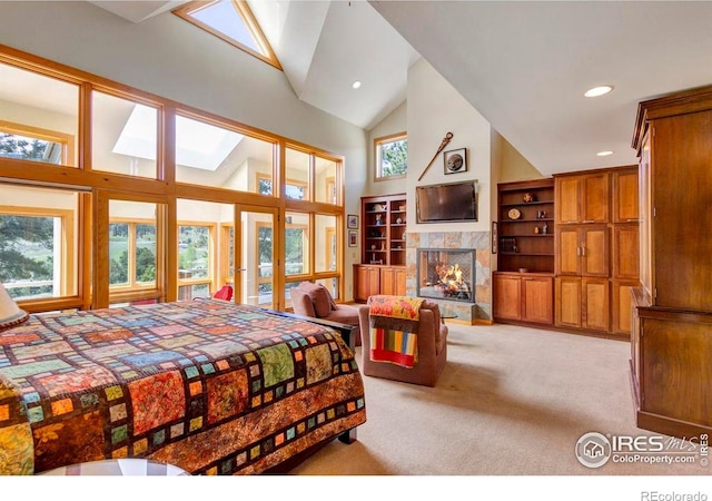 125 Saddleback Ln, Estes Park, CO 80517 - bedroom featuring light carpet, high vaulted ceiling, a premium fireplace, french doors, and recessed lighting